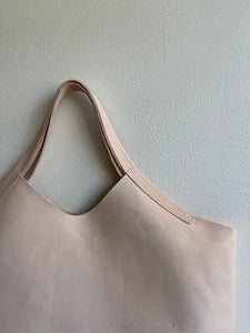 close up of natural veg tan bag short handle wabi sabi stitch detail